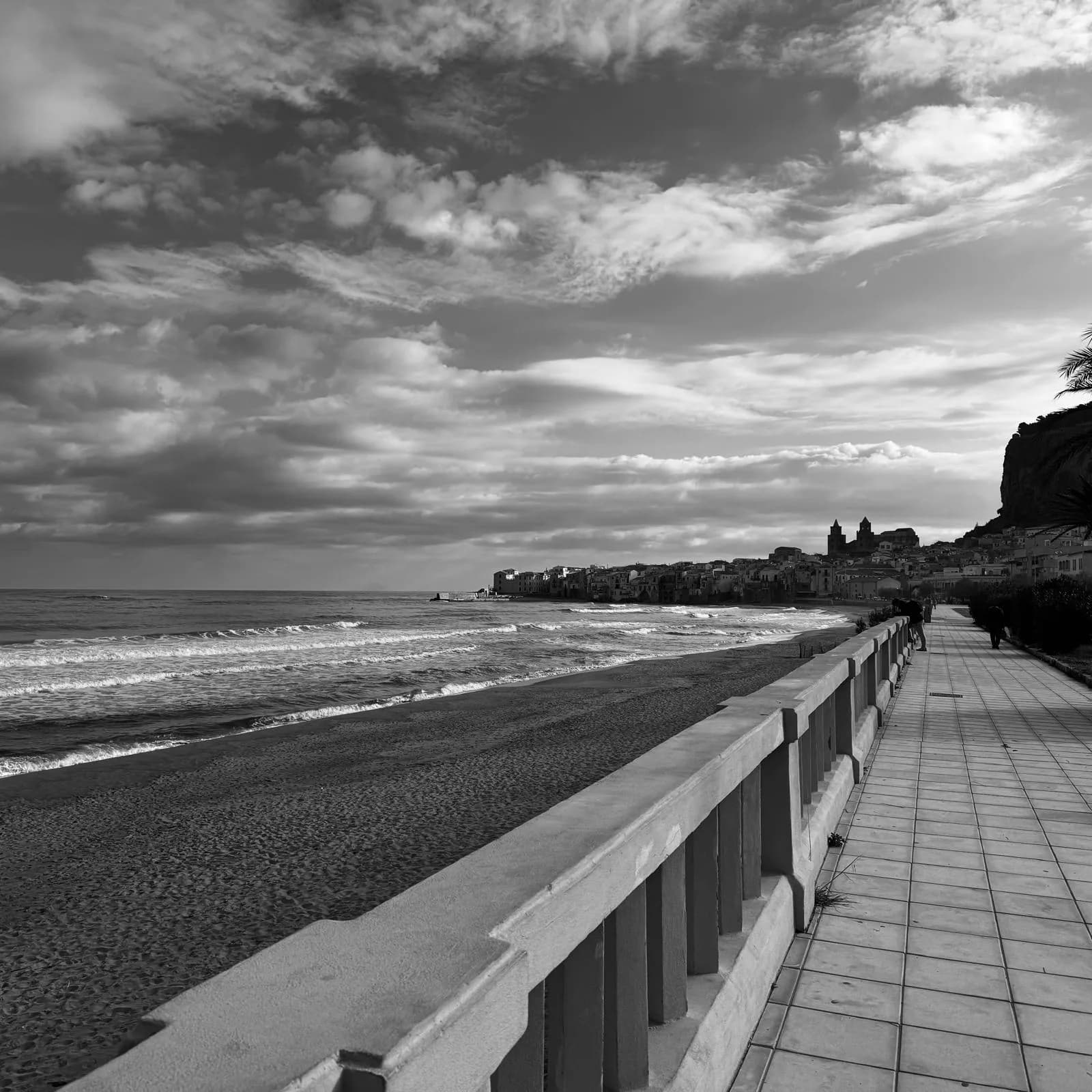 Lungomare seafront promenade with Cefalu old town and La Rocca