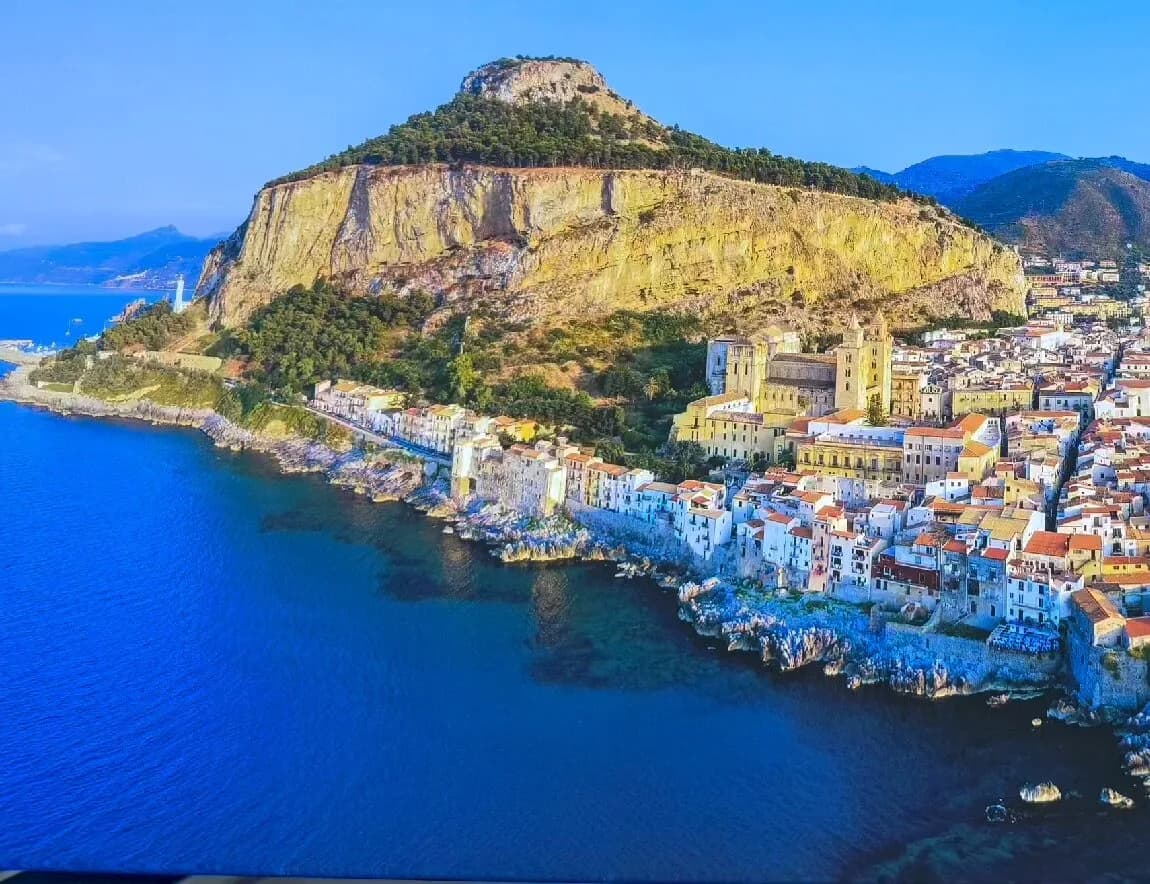 La Rocca cliff towering over Cefalù old town, Sicily