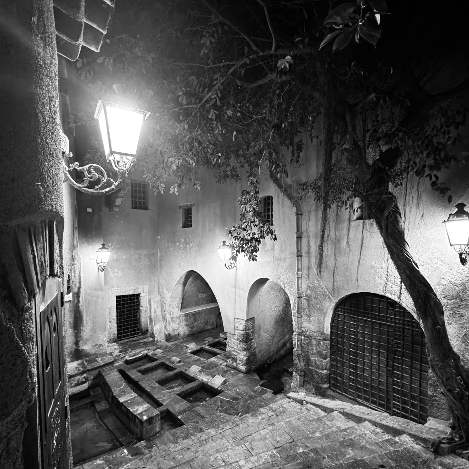 Lantern-lit courtyard in Cefalù, Sicily