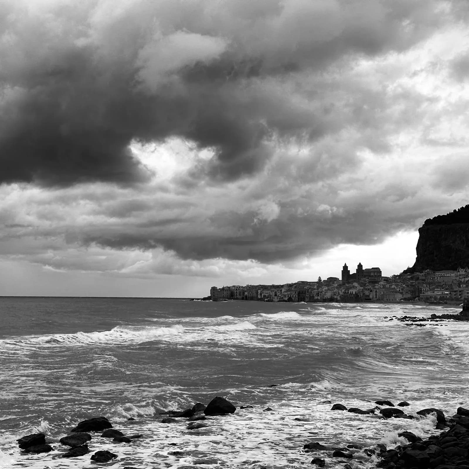 Rocky coastline and clear water near Cefalù