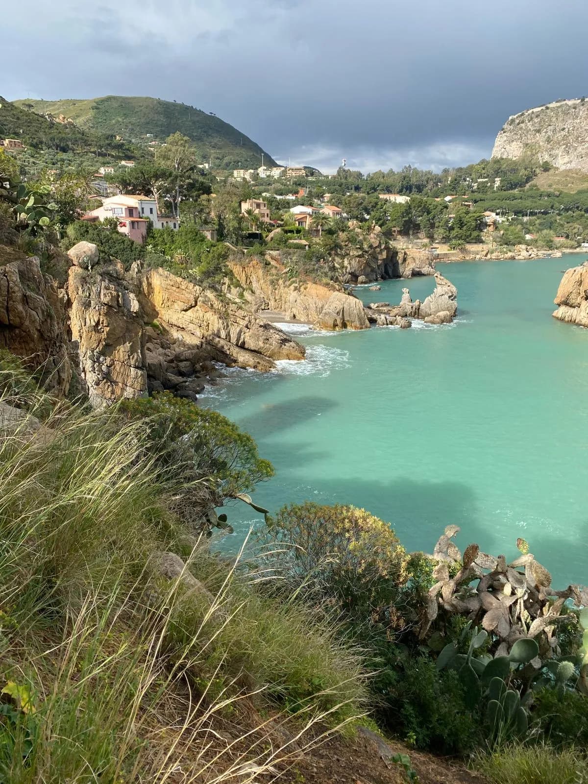 Turquoise cove with rocky cliffs near Kalura, Cefalù