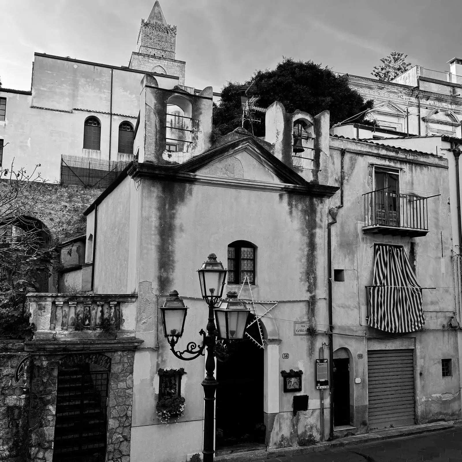 A quiet street in Cefalù's old town, where the Teatro Cicero stands