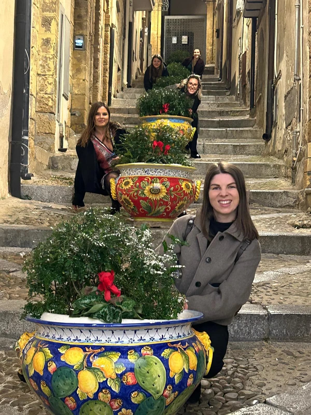 Ceramic vases lining a stepped lane in Cefalù old town