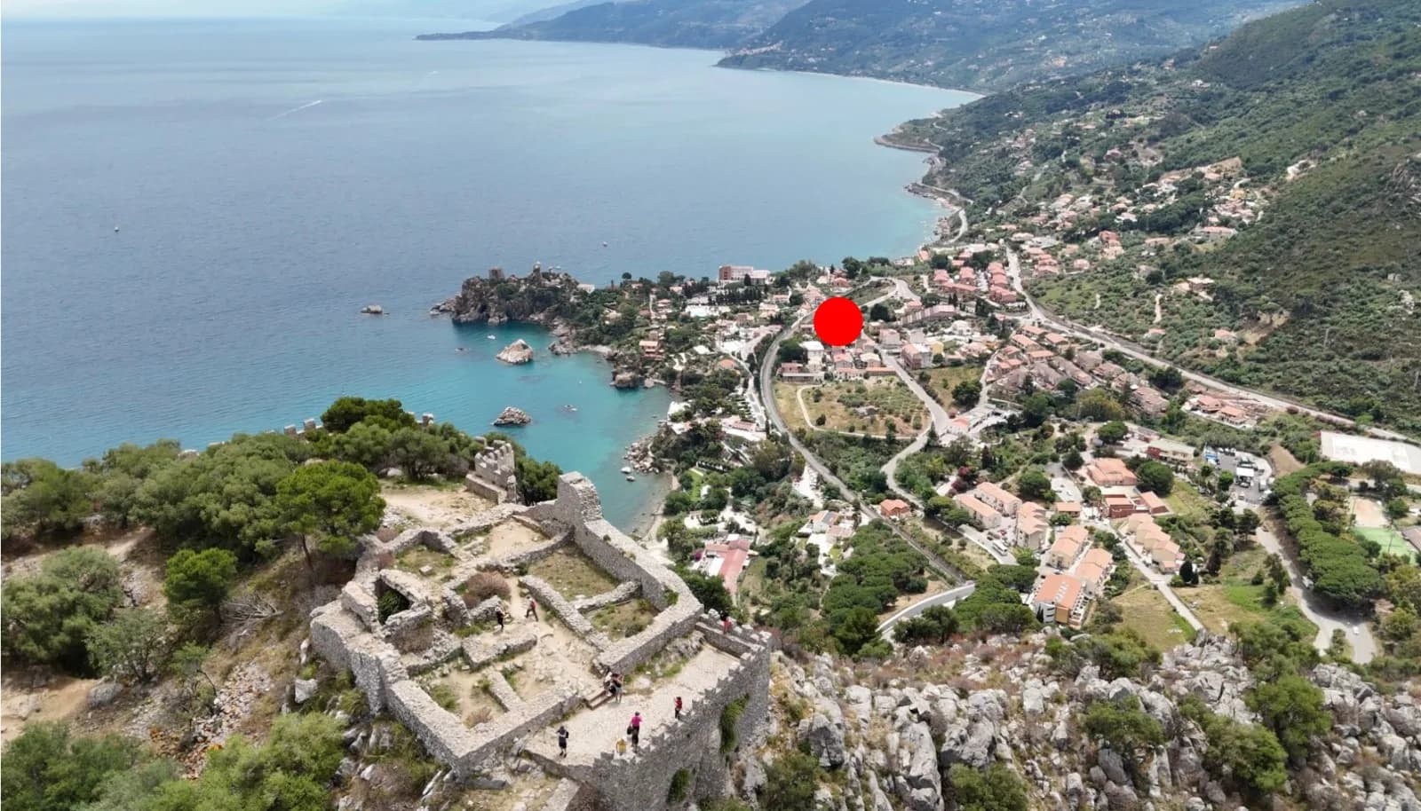 Aerial view over Cefalù Marina, the Kalura headland, and the coast near The Mandarin Tree