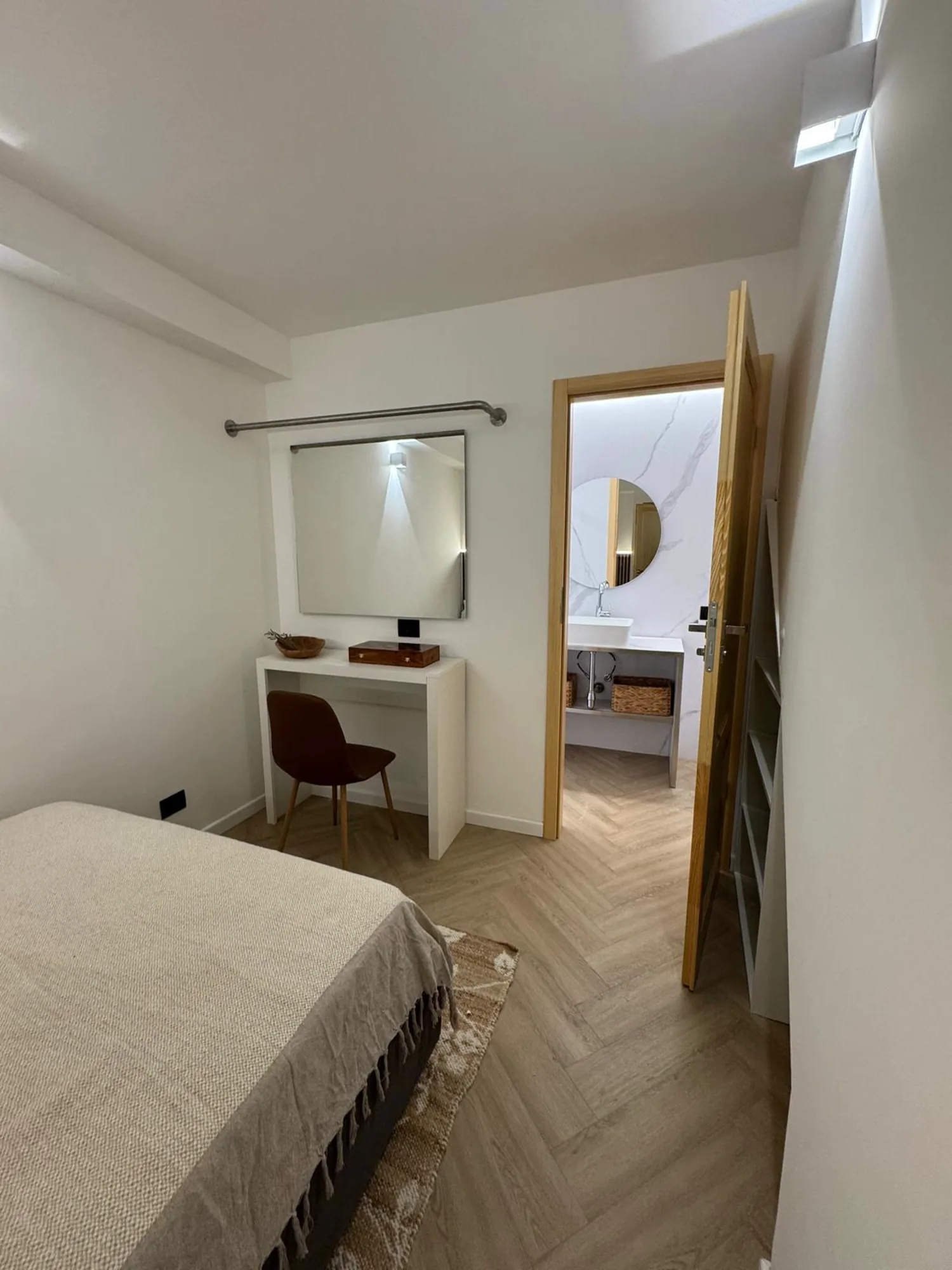 Bedroom opening directly onto its marble ensuite bathroom