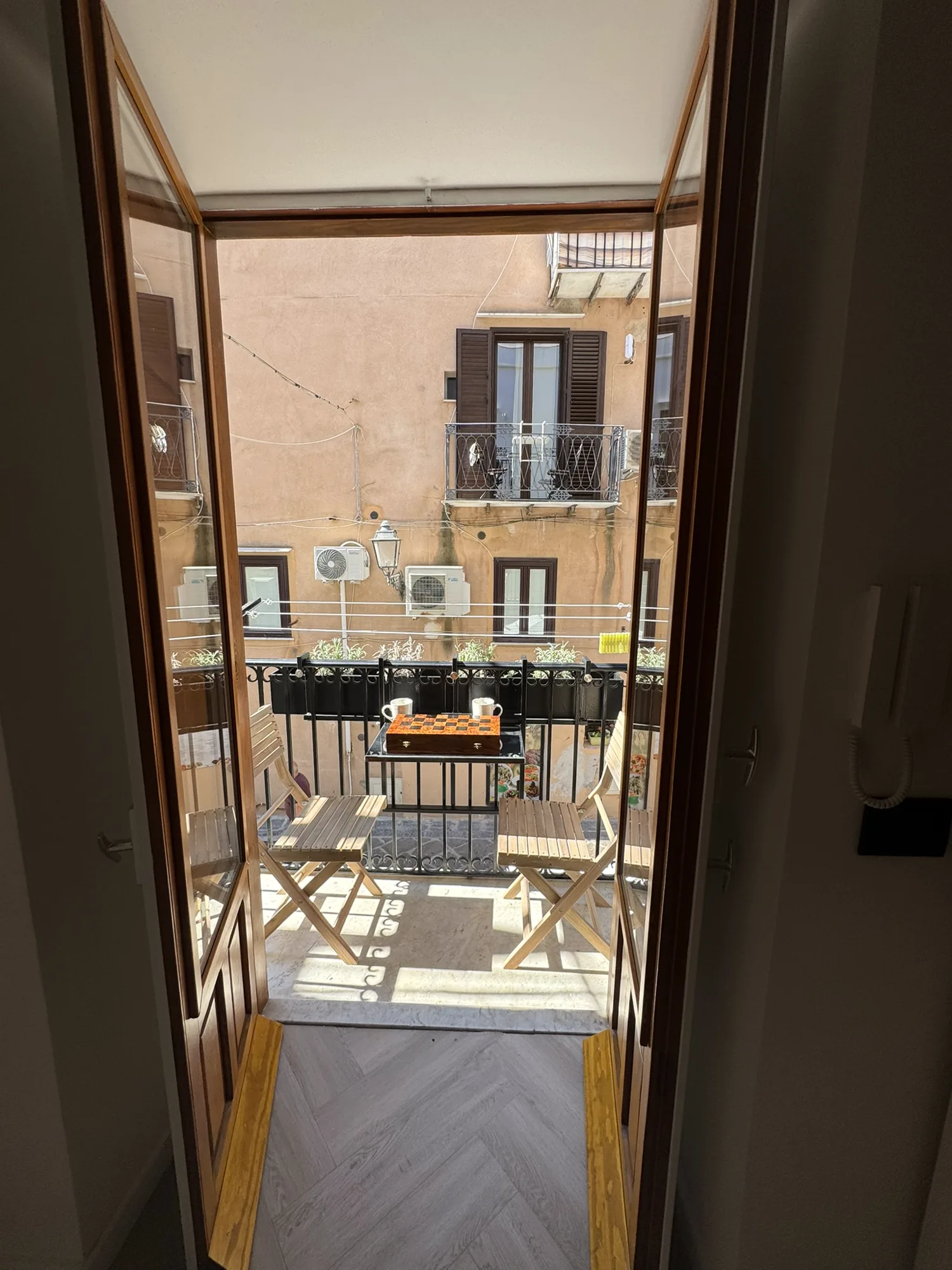 Balcony over Via Candeloro in the warm light of early evening