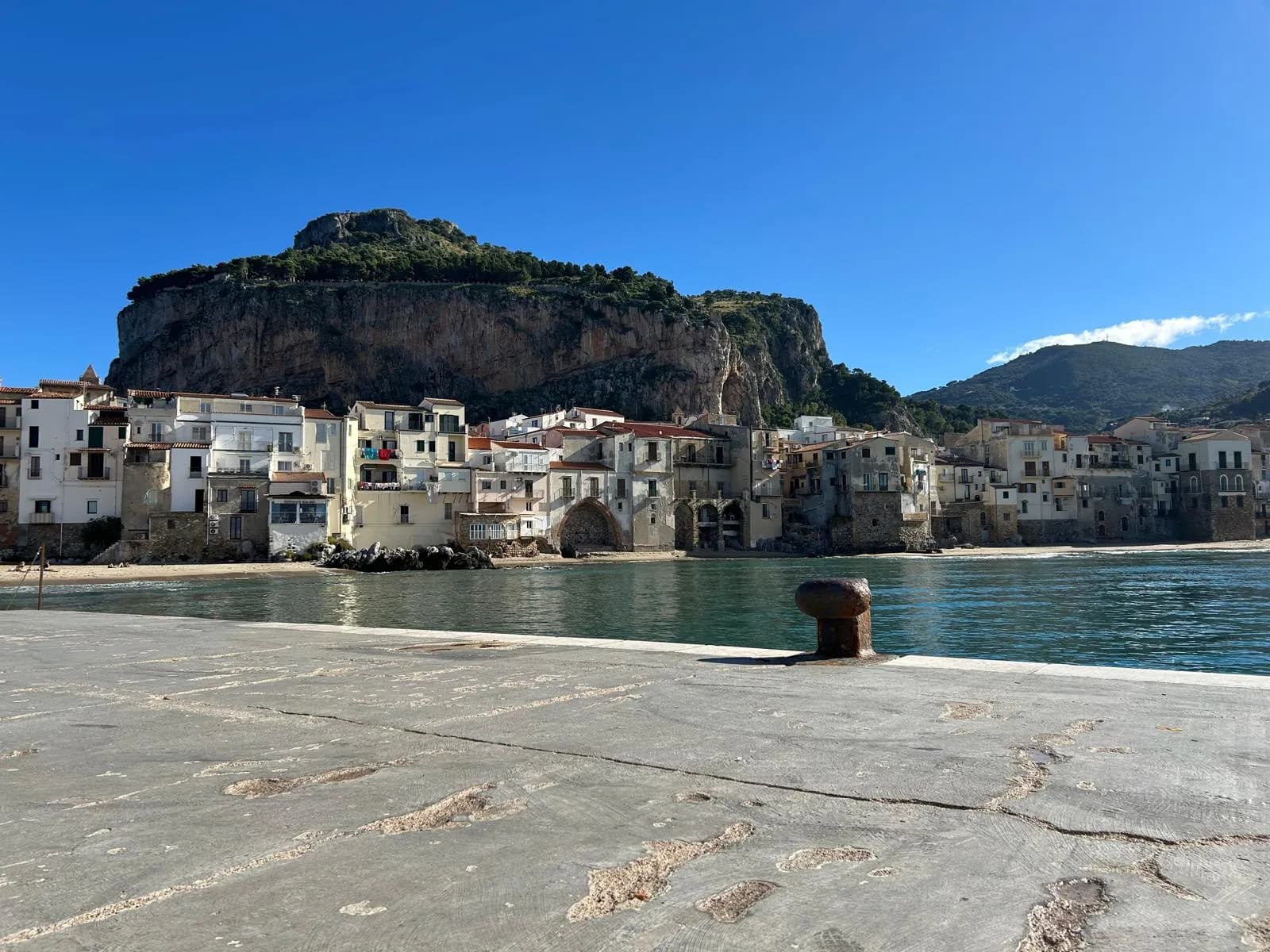 La Rocca and the old town waterfront seen from the harbour pier
