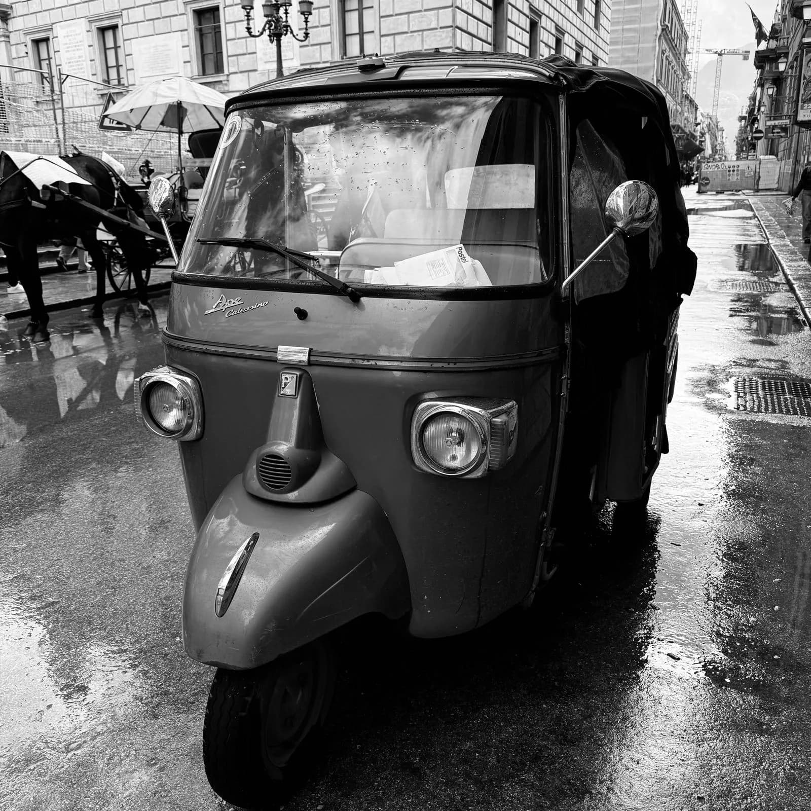 Piaggio Ape three-wheeler on a mountain road in the Madonie